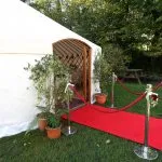 Wedding yurt for hire with red carpet VIP entrance to a luxury yurt with a dining package interior.