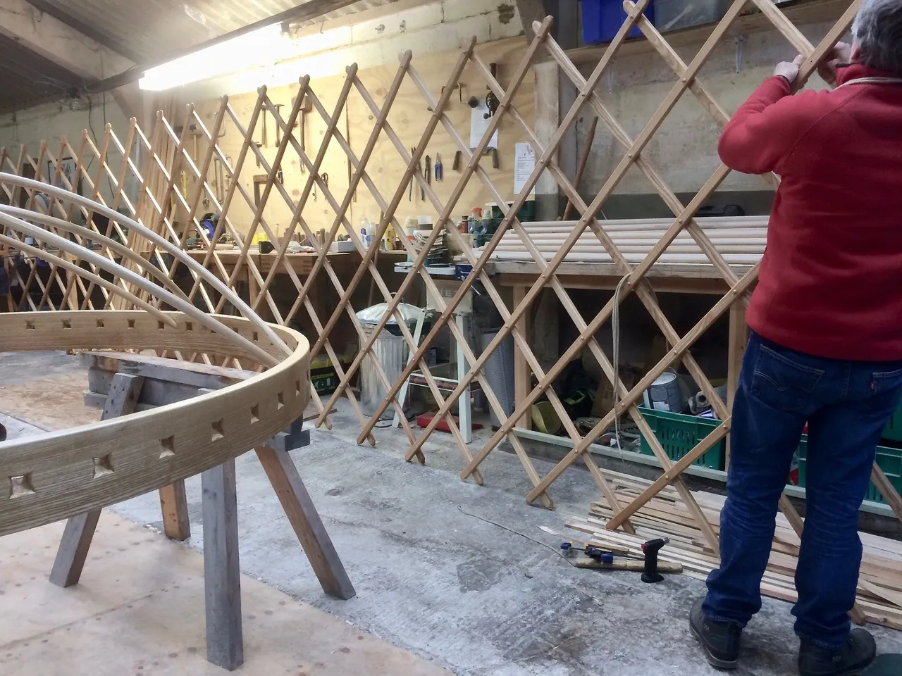 Jeremy knotting trellis wheel in foreground Jeremy knotting trellis wheel in foreground
