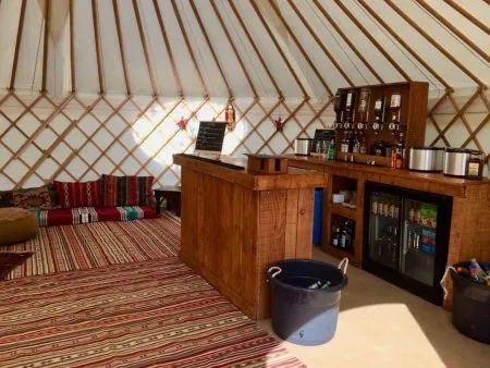 Yurt Bar by Roundhouse Yurts Roundhouse Yurt Hire with a Bar interior package.