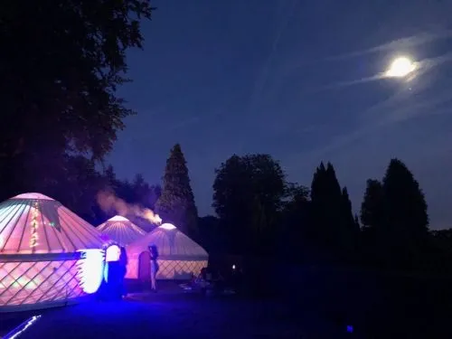 Party in a Roundhouse Yurt Guests enjoying a party in a collection of Roundhouse Yurts.